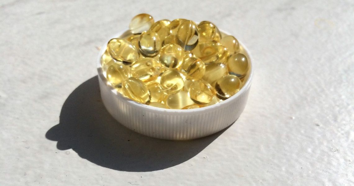 Vitamin capsules in a bowl